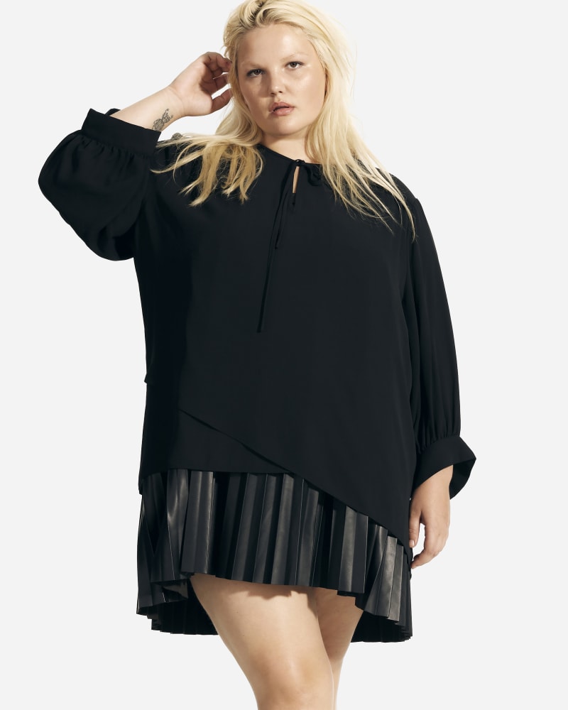 Front of a model wearing a size 1X Fatima Tie Neck Peasant Blouse in Black by T Tahari. | dia_product_style_image_id:229114